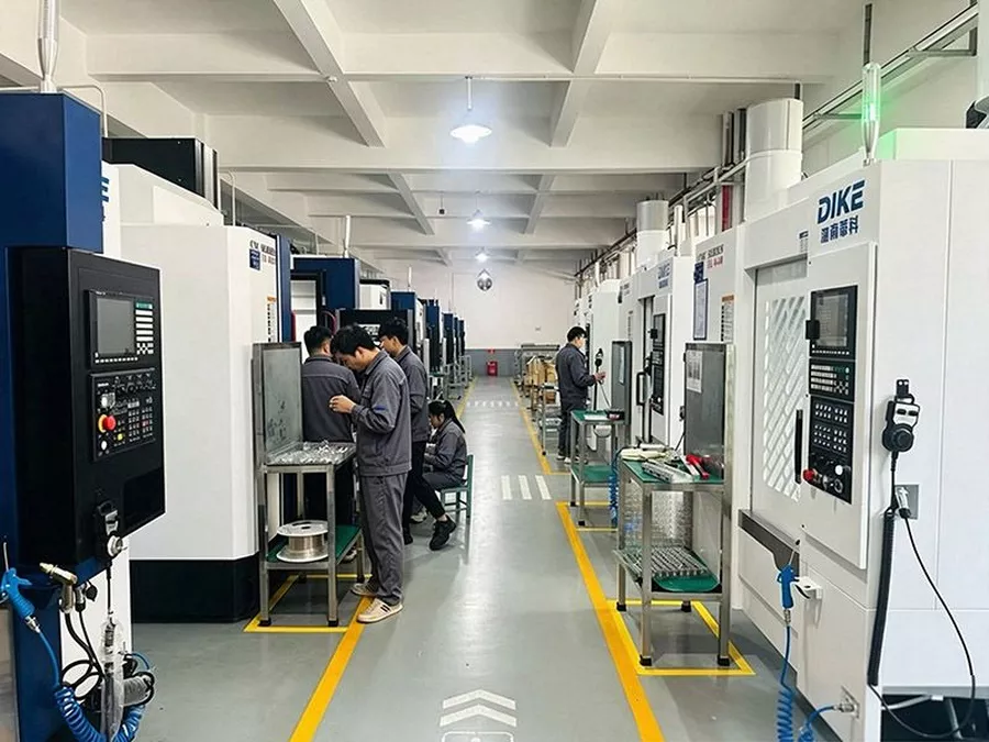 Full CNC workshop floor with operators